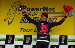 ..|_ Hayden Roulston on the podium following Stage Seven